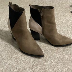 Cream, black, and brown boots